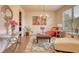 Cozy sitting area with bright decor, featuring a decorative rug, accent chairs, and natural light from a window at 164 Madison Grace Ave, Mcdonough, GA 30252