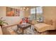 Stylish seating area with patterned rug, side tables, decor accents, and natural light from a window at 164 Madison Grace Ave, Mcdonough, GA 30252