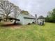 View of the backyard featuring a detached carport and gazebo-like structure at 204 Appalachee Church Rd, Auburn, GA 30011