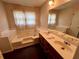 Bathroom featuring double sinks and soaking tub at 204 Appalachee Church Rd, Auburn, GA 30011