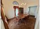Inviting dining room with chandelier and ample seating space, ideal for Gathering gatherings at 204 Appalachee Church Rd, Auburn, GA 30011