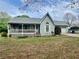 Attractive home with inviting front porch, garage, and pleasing curb appeal at 204 Appalachee Church Rd, Auburn, GA 30011