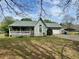 Charming single-story home with a inviting front porch and well-maintained yard at 204 Appalachee Church Rd, Auburn, GA 30011