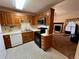 Cozy kitchen featuring essential appliances, ample cabinet space and convenient access to the living room at 204 Appalachee Church Rd, Auburn, GA 30011