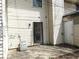 Home's backyard featuring dual doors and a concrete patio at 3695 Church St, Clarkston, GA 30021