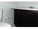 Bathroom with a vanity featuring a dark wood cabinet and a marble countertop at 3695 Church St, Clarkston, GA 30021