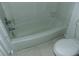 Bathroom with a standard white tub and toilet at 3695 Church St, Clarkston, GA 30021