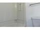Bathroom with a clean white tub and shower combo with built in shelving at 3695 Church St, Clarkston, GA 30021