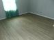 Bright bedroom with wood-look flooring and a view of natural light at 3695 Church St, Clarkston, GA 30021