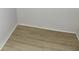 Bedroom featuring wood look laminate flooring and white trim at 3695 Church St, Clarkston, GA 30021