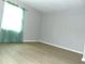 Bright bedroom with wood-look flooring and a view of natural light at 3695 Church St, Clarkston, GA 30021