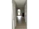 Bright hallway with hardwood floors and white doors at 3695 Church St, Clarkston, GA 30021