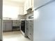 Functional kitchen featuring white cabinets and modern appliances at 3695 Church St, Clarkston, GA 30021