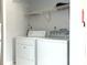Laundry area with white washer and dryer at 3695 Church St, Clarkston, GA 30021