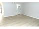 Inviting living room featuring wood-look flooring and fresh, neutral paint at 3695 Church St, Clarkston, GA 30021