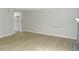Spacious living room features neutral walls, new floors, and a painted fireplace at 3695 Church St, Clarkston, GA 30021