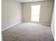 Cozy bedroom featuring plush carpet, neutral walls, and bright natural light at 4093 Chapel Mill Bnd, Decatur, GA 30034