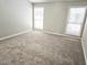 Large bedroom featuring plush carpet and two large windows providing natural light at 4093 Chapel Mill Bnd, Decatur, GA 30034