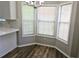 Sunlit breakfast nook featuring modern flooring and bay windows at 4093 Chapel Mill Bnd, Decatur, GA 30034