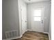 Entryway features gray walls, white trim, wood floor, and white door at 4093 Chapel Mill Bnd, Decatur, GA 30034