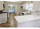 Bright kitchen featuring white cabinets, quartz countertop, and stainless steel appliances at 4093 Chapel Mill Bnd, Decatur, GA 30034