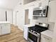 Kitchen showcasing stainless steel microwave and oven appliances with stunning countertops at 4093 Chapel Mill Bnd, Decatur, GA 30034