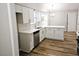 Modern kitchen with white cabinets, stainless steel appliances, and beautiful flooring at 4093 Chapel Mill Bnd, Decatur, GA 30034
