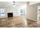 Bright living room featuring a fireplace, modern floors, and open layout at 4093 Chapel Mill Bnd, Decatur, GA 30034