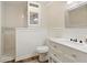 Bathroom features marble tile, white wainscoting, and a modern vanity at 5960 Sarah Orr Ln, Cumming, GA 30040