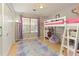 Bedroom with light colored walls, hardwood floors, and a twin sized loft bed at 5960 Sarah Orr Ln, Cumming, GA 30040