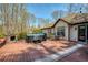 Outdoor deck features a hot tub, and an outdoor fireplace at 5960 Sarah Orr Ln, Cumming, GA 30040