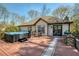 Outdoor deck features a hot tub, a grill, and an outdoor seating area at 5960 Sarah Orr Ln, Cumming, GA 30040