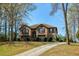 Charming brick two-story home with well-maintained landscaping and a curved driveway at 5960 Sarah Orr Ln, Cumming, GA 30040