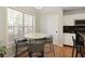 Cozy eat-in kitchen area with a round table, granite countertops, and natural light at 5960 Sarah Orr Ln, Cumming, GA 30040