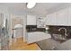Kitchen with stainless steel refrigerator, granite countertops, and hardwood floors at 5960 Sarah Orr Ln, Cumming, GA 30040
