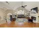 Bright living room with vaulted ceilings, fireplace, chandelier, and hardwood floors at 5960 Sarah Orr Ln, Cumming, GA 30040