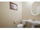 Compact half bathroom with pedestal sink, toilet, and neutral wall color at 792 Russell Dr, Riverdale, GA 30296