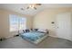 Bedroom with natural light and vaulted ceiling. Neutral colors and carpet at 792 Russell Dr, Riverdale, GA 30296