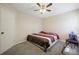 Bedroom features a ceiling fan, carpeted floor and a hammock near the window at 792 Russell Dr, Riverdale, GA 30296