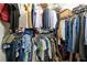 Walk-in closet featuring metal racks fully stocked with clothing and storage at 792 Russell Dr, Riverdale, GA 30296