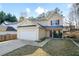 Charming two-story home with a two-car garage and well-maintained landscaping at 792 Russell Dr, Riverdale, GA 30296