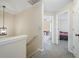 Upstairs hallway with neutral carpet and lighting, leading to bedrooms at 792 Russell Dr, Riverdale, GA 30296