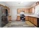 Bright kitchen boasts stainless steel appliances, white counters, and oak cabinets at 792 Russell Dr, Riverdale, GA 30296