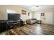 Spacious living room featuring laminate flooring, ample natural light and neutral wall color at 792 Russell Dr, Riverdale, GA 30296