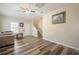 Inviting living room features laminate flooring, and staircase leading to the upper level at 792 Russell Dr, Riverdale, GA 30296