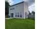 Well-maintained backyard with green lawn, patio area, and privacy fence, perfect for outdoor activities and relaxation at 1503 Korona Ct, Woodstock, GA 30188