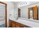 Bathroom with a large mirror and a vanity sink at 2425 Shiloh Sw Dr, Marietta, GA 30064