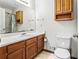 Functional bathroom with oak vanity and a shower, designed to maximize space and convenience at 2425 Shiloh Sw Dr, Marietta, GA 30064