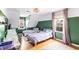 Comfortable bedroom with two twin beds, window nook, and hardwood floors providing charm and functionality at 2425 Shiloh Sw Dr, Marietta, GA 30064