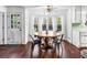 Bright dining area with a round table, hardwood floors, large windows, and lots of natural light at 2425 Shiloh Sw Dr, Marietta, GA 30064